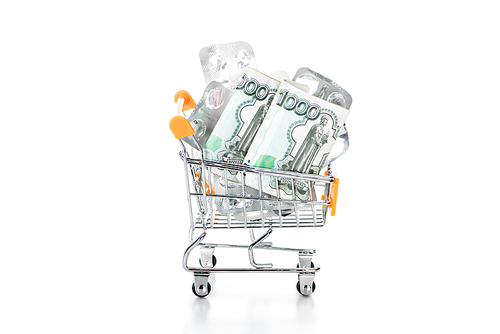 trolley cart with russian cash money and empty pills packages isolated on white