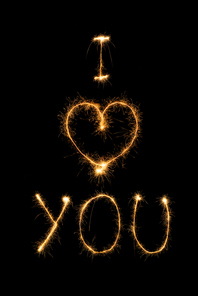 close up view of i love you light sign on black background