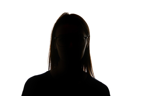 Silhouette of woman in glasses  isolated on white