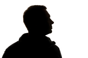 Silhouette of man looking away isolated on white