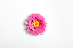 top view of pink and lilac paper flower on grey background