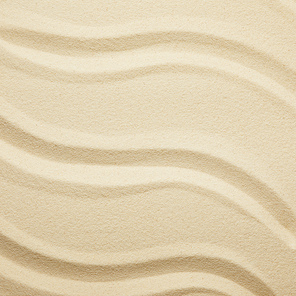 close up of golden textured sandy beach in summer