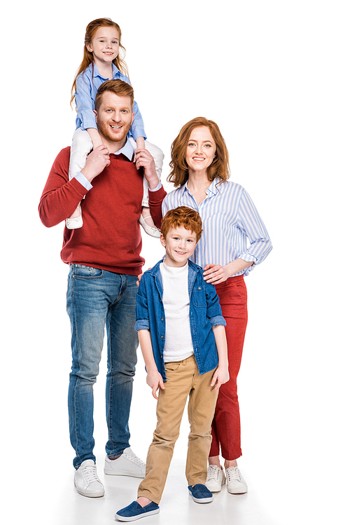 full length view of happy red haired family standing together and smiling at camera isolated on white