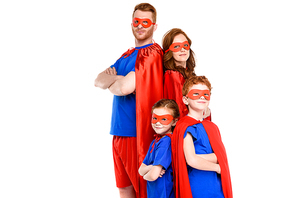 family in superhero costumes standing with crossed arms and  isolated on white