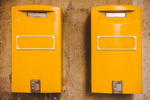 yellow post boxes on wall in Rome, Italy