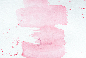 abstract creative texture with pink watercolor strokes and splatters