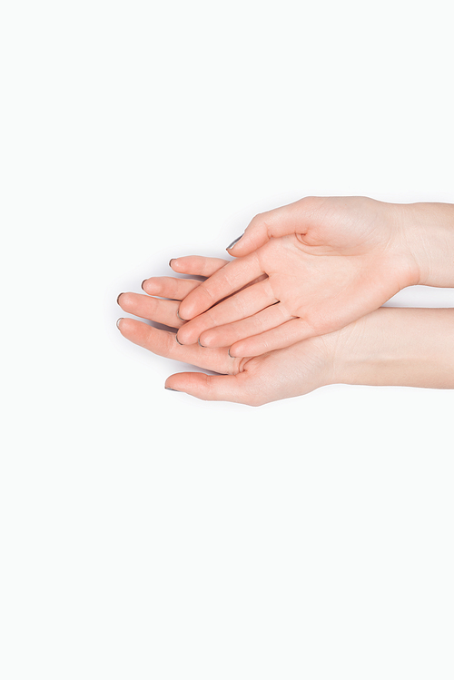 top view of female hands isolated on white