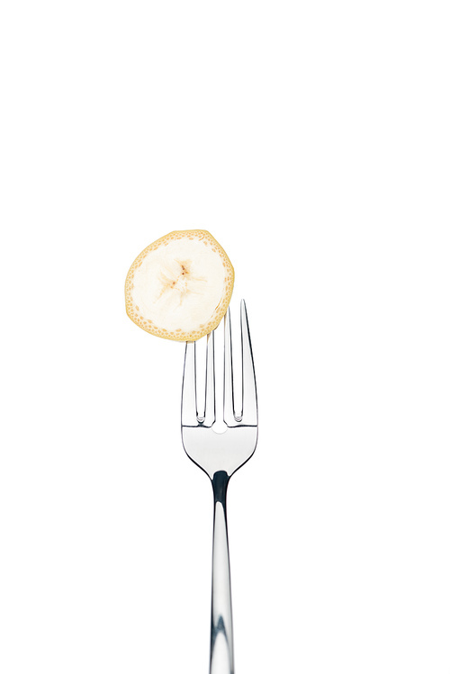 circle slice of fresh sweet banana on fork isolated on white isolated on white isolated on white