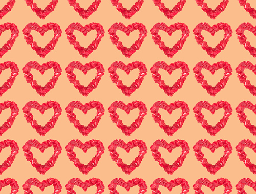 seamless pattern from beautiful decorative red hearts on orange background