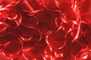 close-up view of decorative ribbons on red background, valentines day concept