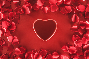 top view of beautiful heart and decorative petals on red background, valentines day concept