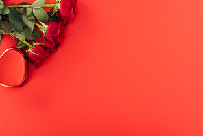 top view of roses isolated on red with copy space, st valentines day concept