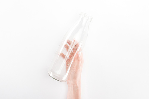 Cropped view of woman holding empty glass bottle
