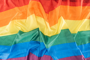 top view of creased lgbt pride flag, lgbt concept