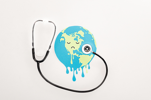 paper cut melting globe with sad face expression, and stethoscope on white background, global warming concept
