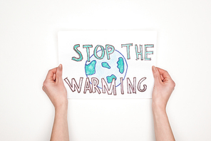partial view of woman holding card with melting globe sign and stop the warming lettering on white background