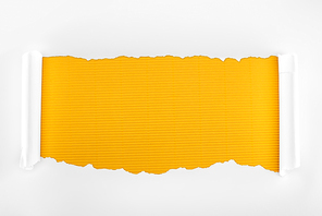 ripped white textured paper with curl edges on yellow striped background