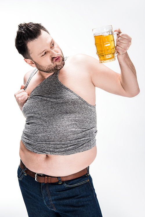 overweight man pouting lips and holding glass of beer isolated on white