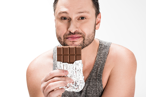 chubby man  and holding chocolate isolated on white