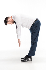 overweight man in tight formal wear bending over and stretching on white