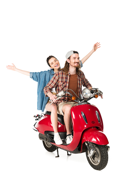 full length view of couple of young tourists riding on red scooter holding hands in air isolated on white