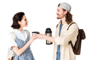 side view of young man sharing cup with girl isolated in white