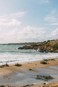 sandy beach near mediterranean sea against blue sky