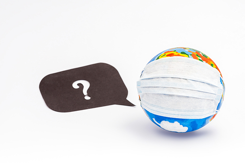 globe in protective medical mask near speech bubble with question mark on white