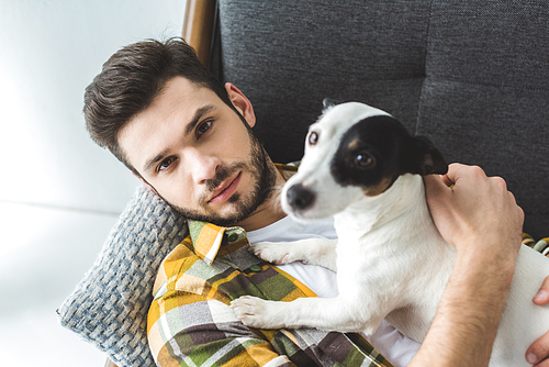 handsome man and jack russell terrier dog 