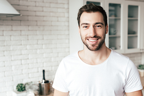 front view of smiling bearded man 