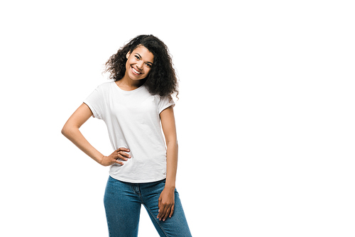 happy african american girl in white t-shirt standing with hand on hip isolated on white