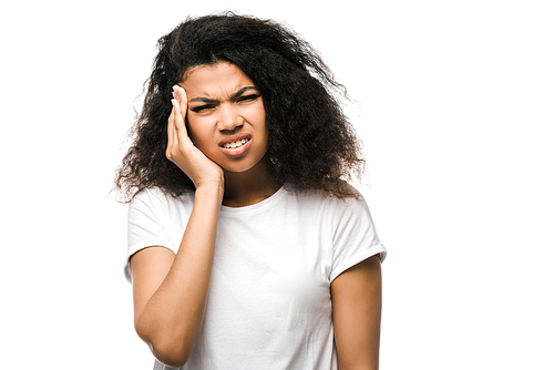 curly african american girl in white t-shirt touching head while having headache isolated on white