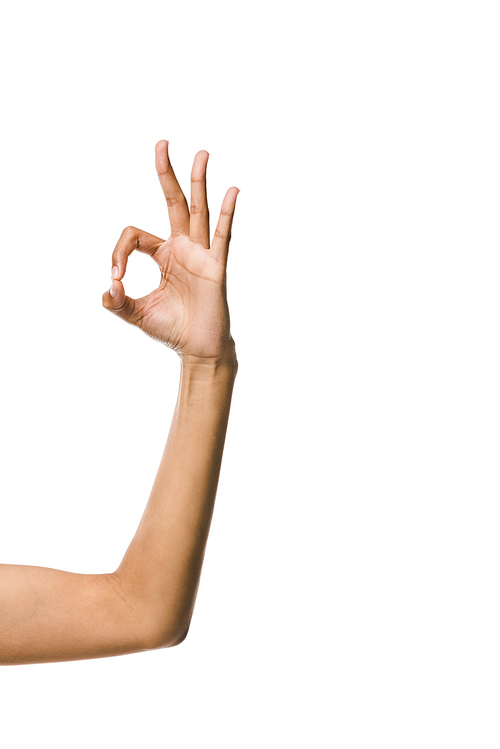 cropped view of african american woman showing ok sign isolated on white