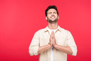 handsome man doing please gesture Isolated On pink