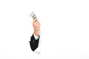 Cropped view of man holding money through hole in paper wall on white with copy space