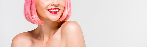 cropped view of smiling naked girl in pink wig isolated on grey
