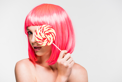 pretty naked woman in pink wig holding sweet lollipop, isolated on grey