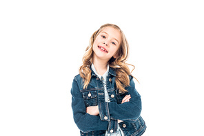 kid in denim jacket standing with crossed arms and smiling isolated on white