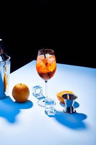cocktail Aperol Spritz, oranges, shaker, ice cubes and measuring cup