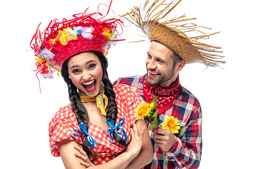 man and excited young woman in festive clothes with sunflowers isolated on white