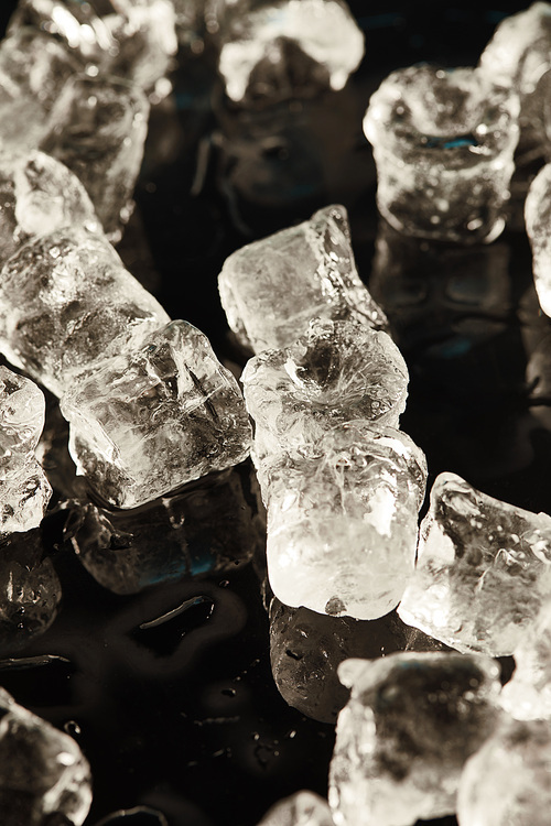 transparent cool ice cubes on black background