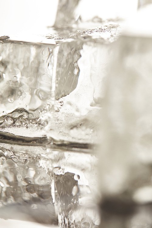 close up view of pure transparent wet textured ice cubes