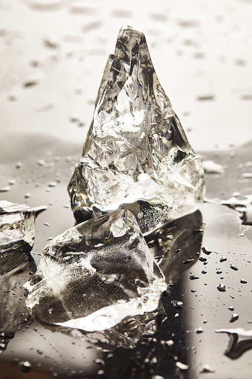 pure melting ice cubes with drops on surface