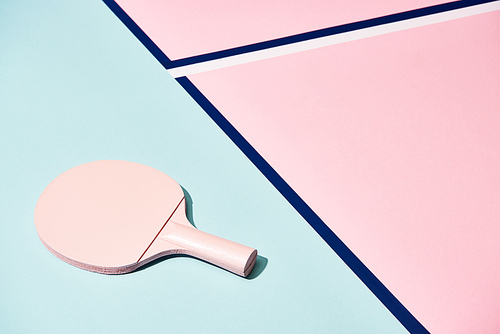 Tennis racket on pastel background with blue lines
