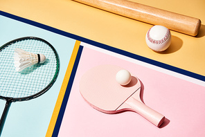 Sets for badminton, table tennis and baseball on colorful background with lines