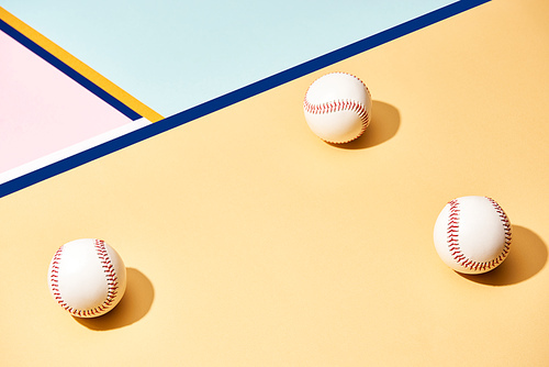 White baseball balls on surface with blue lines