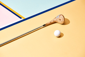 Golf club and ball on surface with blue lines