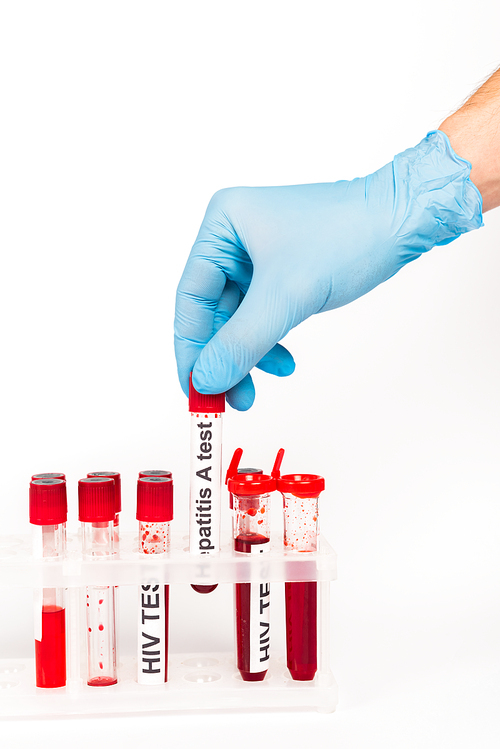 cropped view of scientist in blue latex glove holding sample with hepatitis a test lettering isolated on white