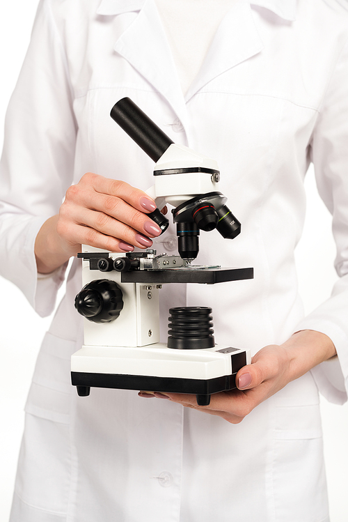 cropped view of scientist holding microscope isolated on white