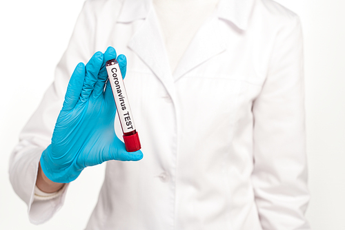 cropped view of scientist holding sample with blood and coronavirus test lettering isolated on white